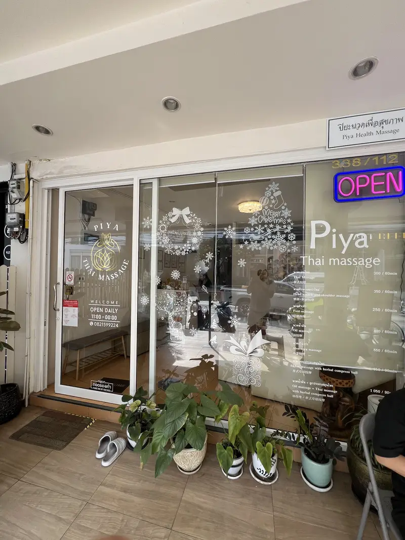 The shopfront by day, with the price list in the window